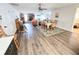 Open living room with dining area and wood floors; inviting and spacious at 4048 Orient Dr, Hernando Beach, FL 34607