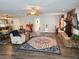 Spacious living room showcasing wood floors, a stone fireplace, and an open layout at 4048 Orient Dr, Hernando Beach, FL 34607