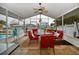 Screened patio with elegant dining set overlooking waterfront and the neighborhood's scenic views at 4048 Orient Dr, Hernando Beach, FL 34607