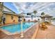Inviting pool area with brick coping, a poolside gazebo, and views of the canal at 4048 Orient Dr, Hernando Beach, FL 34607