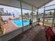 Enjoy the waterfront view from the enclosed sunroom or relax by the pool and the gazebo at 4048 Orient Dr, Hernando Beach, FL 34607