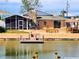 Waterfront home with a screened in lanai, stone chimney and a dock, perfect for enjoying outdoor living at 4048 Orient Dr, Hernando Beach, FL 34607