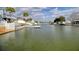 Scenic view of a waterfront community with homes lining the canal, showcasing a peaceful and idyllic residential area at 4048 Orient Dr, Hernando Beach, FL 34607