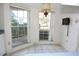 A bright breakfast nook featuring large windows and plenty of natural light at 4707 Wallingford Ct # 4707, New Port Richey, FL 34655