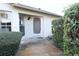A welcoming front entrance surrounded by lush greenery and a well-manicured lawn at 4707 Wallingford Ct # 4707, New Port Richey, FL 34655