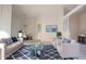 A bright, naturally lit living room featuring stylish furniture and neutral decor at 4707 Wallingford Ct # 4707, New Port Richey, FL 34655