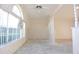 A spacious living room with a large arched window and natural light at 4707 Wallingford Ct # 4707, New Port Richey, FL 34655
