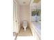 Well-lit bathroom with double sink vanity, and a neutral color scheme at 4707 Wallingford Ct # 4707, New Port Richey, FL 34655