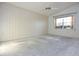 Bedroom with a neutral palette and a large window creating a bright and welcoming atmosphere at 4707 Wallingford Ct # 4707, New Port Richey, FL 34655
