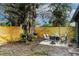 Backyard features a BBQ grill and a stone patio with outdoor furniture at 506 8Th Ave Sw, Largo, FL 33770