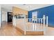 Kitchen view with an island counter, hardwood floors and a small decorative railing at 6040 Palm Creek Dr, Weeki Wachee, FL 34607