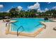 Spacious community pool with multiple entry points and ample lounge chairs for residents to enjoy at 6152 Clark Lake Dr, New Port Richey, FL 34655