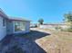 Fenced backyard with sliding glass door at 7421 San Miguel Dr, Port Richey, FL 34668