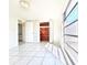 Bright bedroom with a cedar closet, tile floors, and ample sunlight at 7421 San Miguel Dr, Port Richey, FL 34668