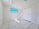 Cozy bedroom with tile floors, natural light, and closet space at 7421 San Miguel Dr, Port Richey, FL 34668