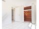 Bedroom featuring a cedar closet, tile floors, and natural light at 7421 San Miguel Dr, Port Richey, FL 34668