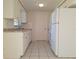 Functional kitchen with white cabinets, granite countertops, and essential appliances at 7421 San Miguel Dr, Port Richey, FL 34668