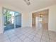 Bright living room with tile flooring and sliding glass doors to the backyard at 7421 San Miguel Dr, Port Richey, FL 34668