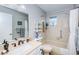 Bright bathroom with shower/tub, vanity, and natural light, providing a functional space at 8110 Bismark Ct, Port Richey, FL 34668