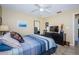 Comfortable bedroom with ceiling fan, dresser and mirror providing a serene space at 8110 Bismark Ct, Port Richey, FL 34668