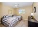 Charming bedroom with twin beds, tiled floors, and ample natural light at 8110 Bismark Ct, Port Richey, FL 34668