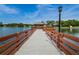 Picturesque dock with benches and gazebo offering serene lakeside views and a tranquil retreat for relaxation at 8110 Bismark Ct, Port Richey, FL 34668