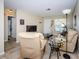 Cozy living room featuring tile flooring, neutral decor, and ample space for relaxation at 8110 Bismark Ct, Port Richey, FL 34668