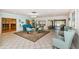 Lobby has neutral tones, tiled floors, and comfortable seating and decor at 8110 Bismark Ct, Port Richey, FL 34668