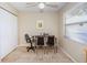 Dedicated home office space with tile floors, a ceiling fan and natural light from a window at 8110 Bismark Ct, Port Richey, FL 34668