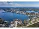 This aerial view showcases the home's waterfront location on Miller's Bayou near Sunset Landing Marina/Fuel at 8401 Carolyn Dr, Port Richey, FL 34668