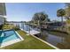 Amazing backyard featuring a beautiful pool and dock with waterfront access at 8401 Carolyn Dr, Port Richey, FL 34668