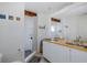 The bathroom is equipped with a double vanity, decorative mirrors, and a tiled shower at 8401 Carolyn Dr, Port Richey, FL 34668