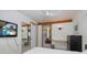 The bedroom features recessed lighting and a mounted flatscreen television at 8401 Carolyn Dr, Port Richey, FL 34668