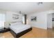 Spacious bedroom with hardwood floors, lots of light, and ceiling fan at 8401 Carolyn Dr, Port Richey, FL 34668