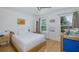 Cozy bedroom with a full-size bed, a ceiling fan and natural light, and a play area at 8401 Carolyn Dr, Port Richey, FL 34668