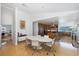 Dining room with a modern table setting, open to a kitchen with stainless steel appliances at 8401 Carolyn Dr, Port Richey, FL 34668