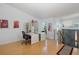 Bright and airy home office featuring hardwood floors, recessed lighting, and modern decor with staircase access at 8401 Carolyn Dr, Port Richey, FL 34668