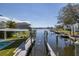 This canal front property features a private boat lift for easy access to waterways and bay at 8401 Carolyn Dr, Port Richey, FL 34668