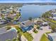 Stunning aerial view of a waterfront property with a boat dock and sparkling blue water at 8408 Damen Ln, Port Richey, FL 34668