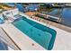 Aerial view of the pool and dock with canal access at 8408 Damen Ln, Port Richey, FL 34668