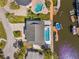 Birds eye view of the home with a pool, spa, and dock on a canal with access to open water at 8408 Damen Ln, Port Richey, FL 34668