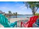 Relaxing backyard seating area overlooking tranquil waterfront views and the canal at 8408 Damen Ln, Port Richey, FL 34668