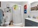 Cozy bathroom with a walk-in shower, toilet, and stylish vanity with boat themed decor at 8408 Damen Ln, Port Richey, FL 34668