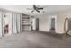 Spacious bedroom featuring plush carpeting, natural light, and access to a private balcony at 8408 Damen Ln, Port Richey, FL 34668