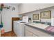 Well-organized laundry room featuring modern appliances, sink, and ample storage space at 8408 Damen Ln, Port Richey, FL 34668