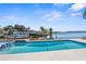 Inviting waterfront pool offers a refreshing oasis with beautiful views for relaxation and enjoyment at 8408 Damen Ln, Port Richey, FL 34668