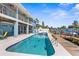 Stunning waterfront pool area for relaxation and entertainment with outdoor living space at 8408 Damen Ln, Port Richey, FL 34668