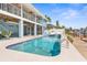 Stunning backyard pool and spa overlooking the canal, with a covered patio and access to the dock at 8408 Damen Ln, Port Richey, FL 34668