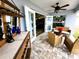 The covered patio features outdoor furniture and a bar, flowing to the home's interior at 9089 Dupont Ave, Spring Hill, FL 34608