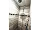 Walk-in shower features tiled walls, an overhead shower head, and handheld shower at 9089 Dupont Ave, Spring Hill, FL 34608